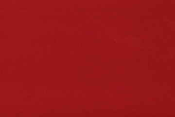 Clean red retro paper background. Vintage cardboard texture. Grunge paper for drawing. Simple blank fabric pattern.
