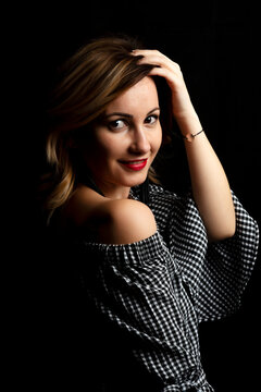 Young lady smiling whit black background