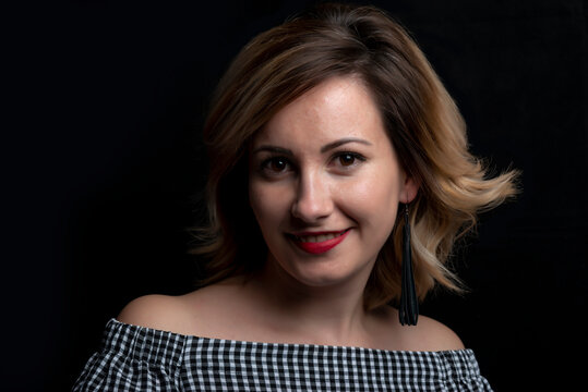 Young lady smiling whit black background