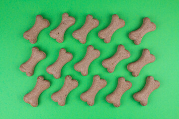 dog food bones on green background pattern