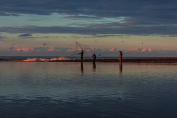 Fisherman in action when fishing in the lake, Algeria, fishing boat traditional and net