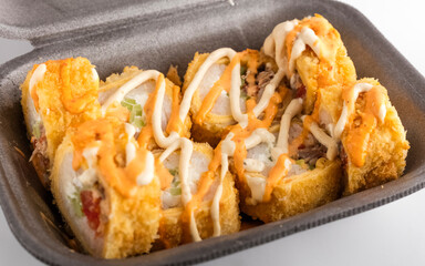 Warm rolls in a food box on a white background. Food delivery concept. Top view