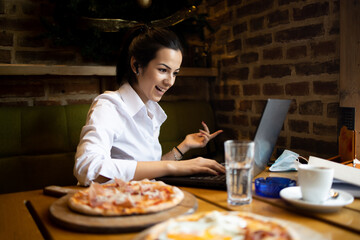 Young businesswoman Communicates with business partners using a laptop 