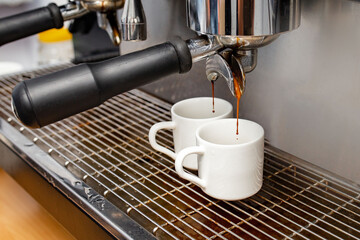 Preparing aromatic, invigorating coffee drinks in a coffee machine (in a cafe)