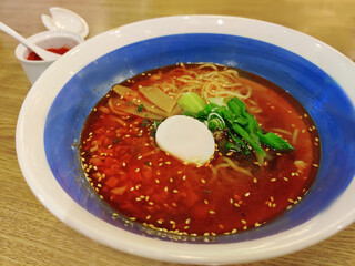 tantan-men or Dandan noodles, ramen with spicy sauce containing preserved vegetables, chili oil, Sichuan pepper, minced pork, egg, and scallions served over noodles