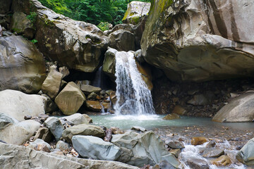 Rapid streams of water falling from cliff.