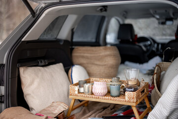 Fototapeta na wymiar A cozy picnic in car trunk during winter