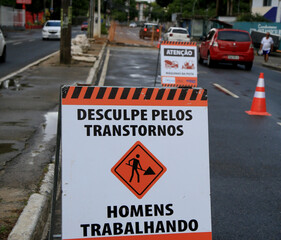 salvador, bahia, brazil - january 15, 2021: sign indicates men working on repairs on a street in...