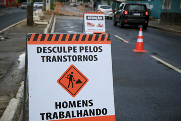 salvador, bahia, brazil - january 15, 2021: sign indicates men working on repairs on a street in...