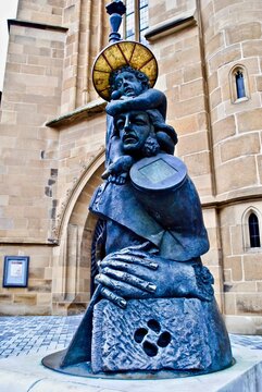 HEILBRONN, GERMANY:  A religious sculpture at St Kilian&rsquo;s Church (Kilianskirche, Kiliansplatz) called "Christophorus." St Christopher, patron saint of travelers carrying Christ by J&uuml;rgen Goertz.