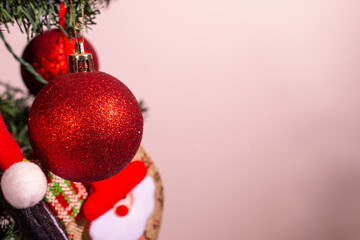 Christmas decoration with highlighted red ball and space for writing. Selective focus.