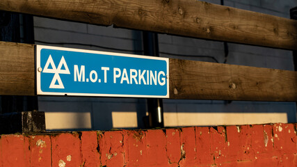 MOT Parking sign on a garage forecourt - obrazy, fototapety, plakaty