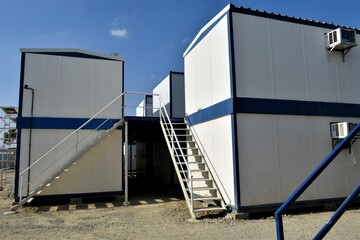 Portacabin, porta cabin, temporary labors camp , Mobile building in industrial site or office container Portable house and office cabins. Labor Camp. Porta cabin. small temporary houses