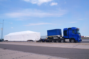 Long vehicle. Over-standard, atypical road transport. A very long and heavy load on a specialized...