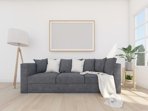 grey sofa in white room with ficture frame and floor lamp