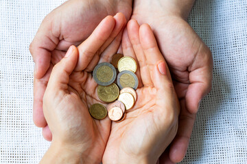 Hands holding money. Donation, saving, charity and financial crisis concept