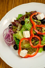 Salad with lettuce, pepper and parmesan cheese