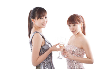 Portrait of two female friends drink champagne