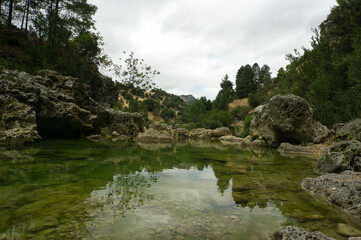 Naklejka na ściany i meble view of the source of the river Borosa located in the Natural Park of the Sierras de Cazorla, Segura and las Villas, Andalucia, Spain.