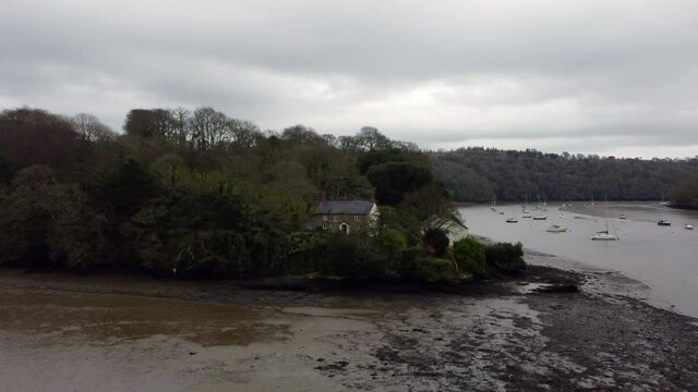 fly upwards with a view along the fal fiver looking at the boats near Malpas truro cornwall England uk 