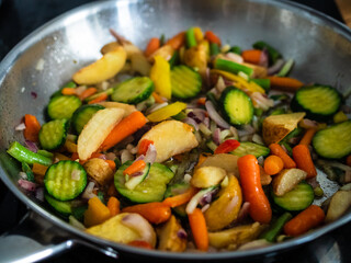 Mix of vegetables cooking in frying pan
