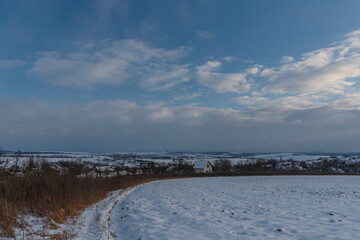 Sunset view near Celoznice village and Kyjov town in winter cold evening