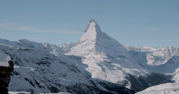 The Matterhorn face east and face north in morning light in winter, Video taken from the hiking trail from Blauherd to Fluhalp, above Zermatt in Valais, Switzerland.
