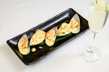Oysters with red caviar on white background