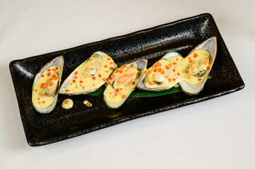 Oysters with red caviar on white background