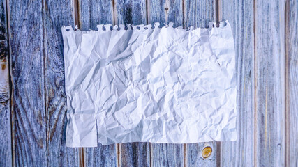 Top view of crumpled blank note paper  wood table for background