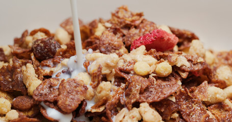 Pour milk into the cereal