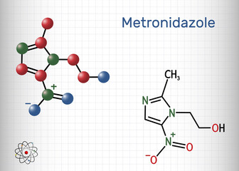 Metronidazole, antiprotozoal medication molecule. It is antibiotic, belonging to the nitroimidazole class of antibiotics. Structural chemical formula and molecule model. Sheet of paper in a cage