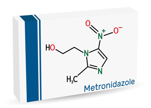 Metronidazole, antiprotozoal medication molecule. It is antibiotic, belonging to the nitroimidazole class of antibiotics. Structural chemical formula. Paper packaging for drugs