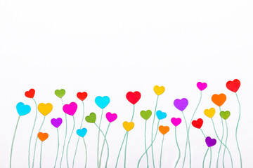 Spring flowers with heart shape with long stem on a white background