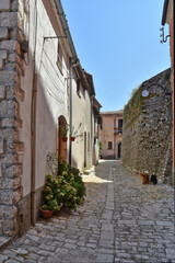 A narrow street between the stone houses of Morcone, an old town in the province of Benevento, Italy.
