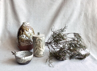 Various ceramic vases and winter dry flowers . Dry flowers bouquet. Winter, autumn ,ceramic floral decor herbarium for home working space.