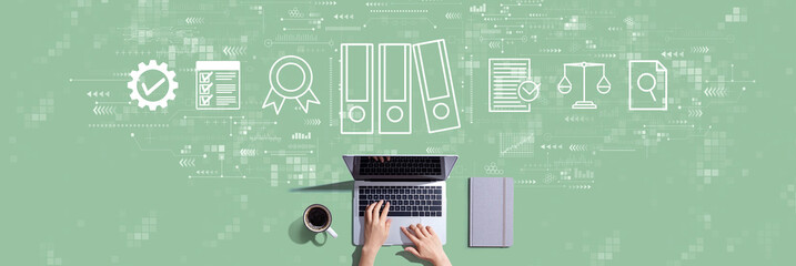Compliance theme with person working with a laptop