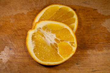 Round orange slices on a background of boards