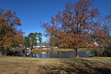 Fountain in a lake with a gazebo in the background