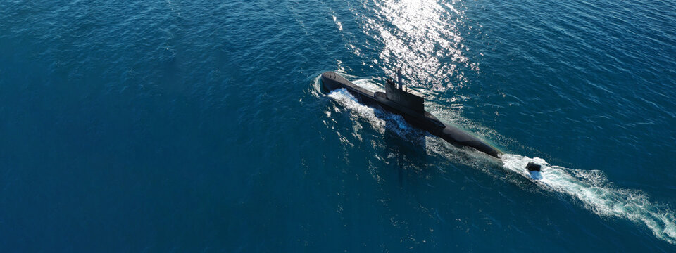 Aerial drone ultra wide panoramic photo of latest technology navy armed diesel powered submarine cruising half submerged deep blue sea