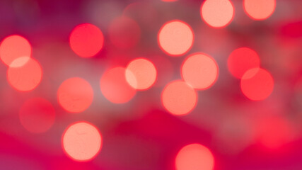 Fototapeta premium Pink bokeh background, pink and red bokeh background, dark valentines day background, blurry pink lights and blurry circles and semicircles, valentines night concept, defocused washed out lights 