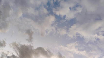 evening sky with white and gray clouds.