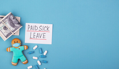 Money, medicine and gingerbread man in a mask inscription paid sick leave