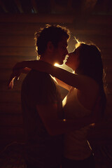 couple in love. Kissing man and woman at home in intimate atmosphere - 406210790