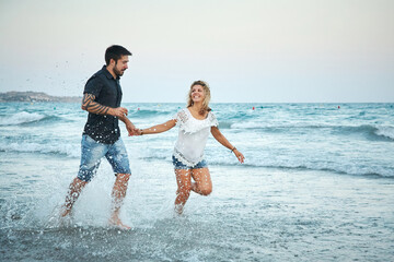 couple in love walking on sea shore