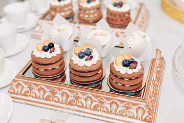 cakes with berries on the mirror spread