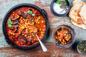 Modern style slow cooked Lebanese vegetarian eggplant stew maghmour served with chickpeas and pita...