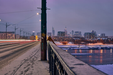 Fototapeta na wymiar Night panorama of Warsaw skyscrapers from poniatowski bridge viewpoint