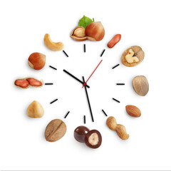 watch with arrows and assorted nuts on a white background