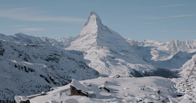 The Matterhorn face east and face north in morning light in winter, Video taken from the hiking trail from Blauherd to Fluhalp, above Zermatt in Valais, Switzerland.
